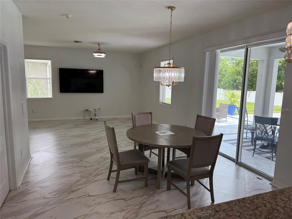 12236 Fairlawn Drive Riverview, FL 33579 - Photo 6 of 52 a view of a dining room with furniture window and outside view