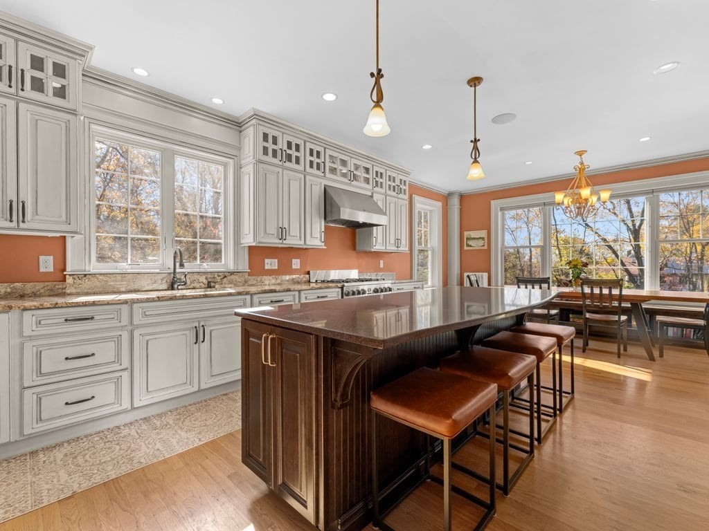 17 Worcester Street Grafton, MA 01519 - Photo 11 of 42 a kitchen with a stove a refrigerator and a living room view