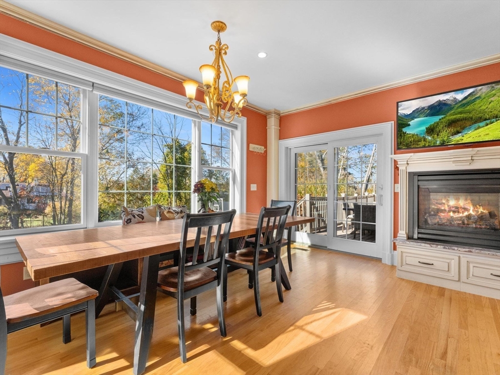 17 Worcester Street Grafton, MA 01519 - Photo 13 of 42 a dining room with furniture a flat screen tv and a floor to ceiling window