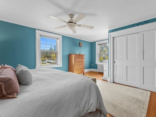 a bedroom with a bed and dresser