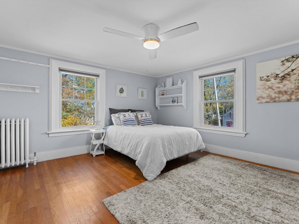 17 Worcester Street Grafton, MA 01519 - Photo 27 of 42 a bedroom with a bed and wooden floor