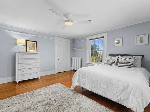 a bedroom with a bed and dresser