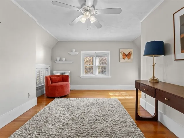 a bedroom with furniture and a window