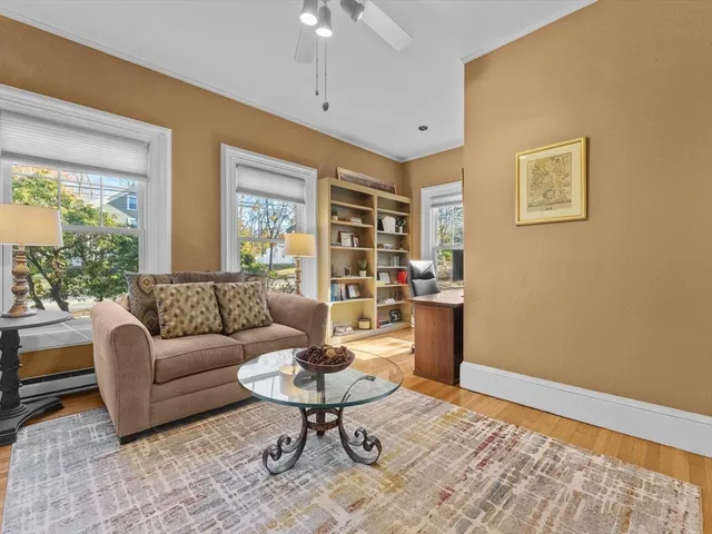 a living room with furniture and a table