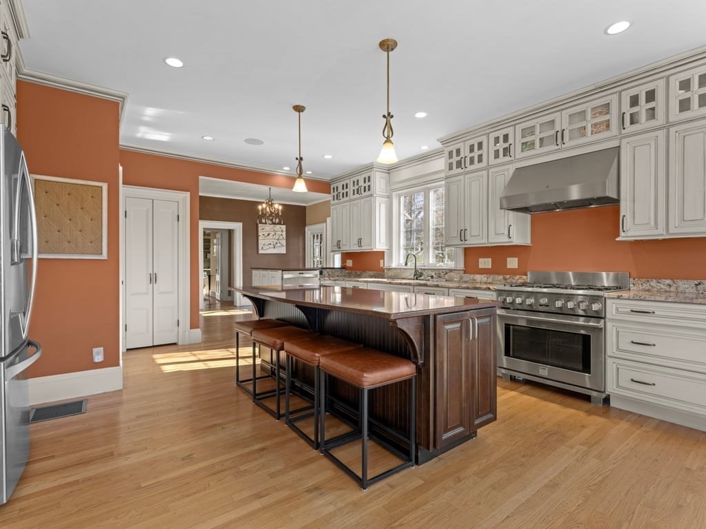 17 Worcester Street Grafton, MA 01519 - Photo 10 of 42 a kitchen with stainless steel appliances granite countertop a stove a sink dishwasher and a refrigerator with wooden floor