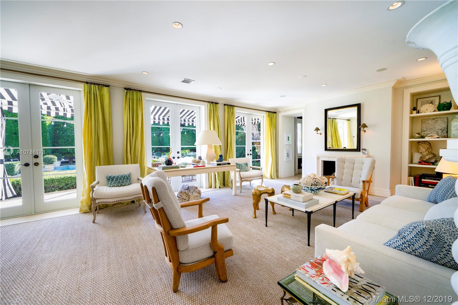 4955 Lakeview Drive Miami Beach, FL 33140 - Photo 17 of 55 a living room with furniture and floor to ceiling windows