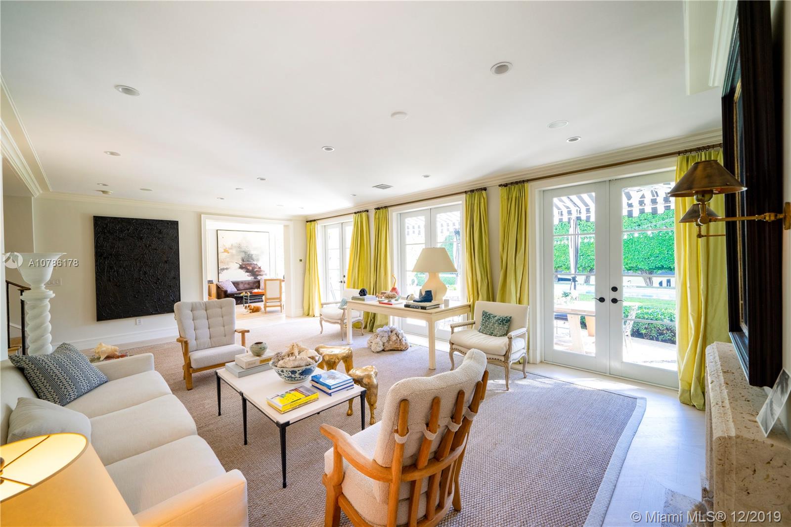 4955 Lakeview Drive Miami Beach, FL 33140 - Photo 18 of 55 a living room with furniture and a flat screen tv