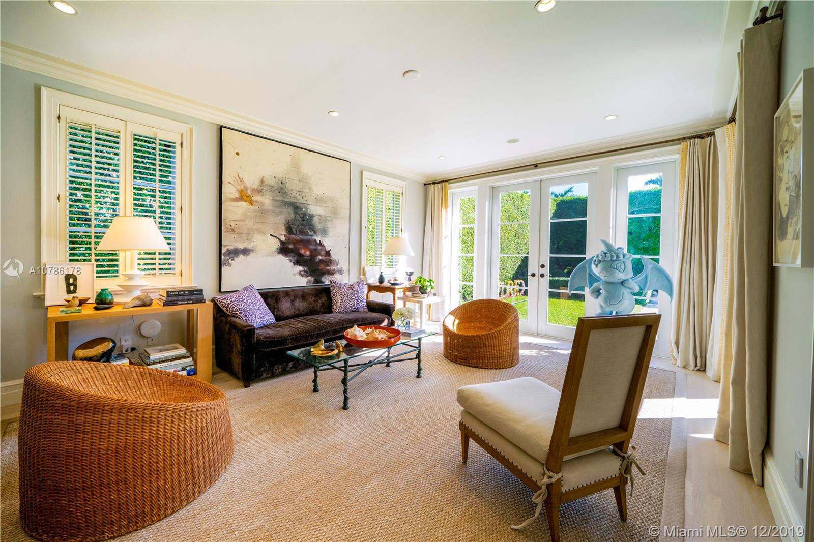 4955 Lakeview Drive Miami Beach, FL 33140 - Photo 20 of 55 a living room with furniture and floor to ceiling windows