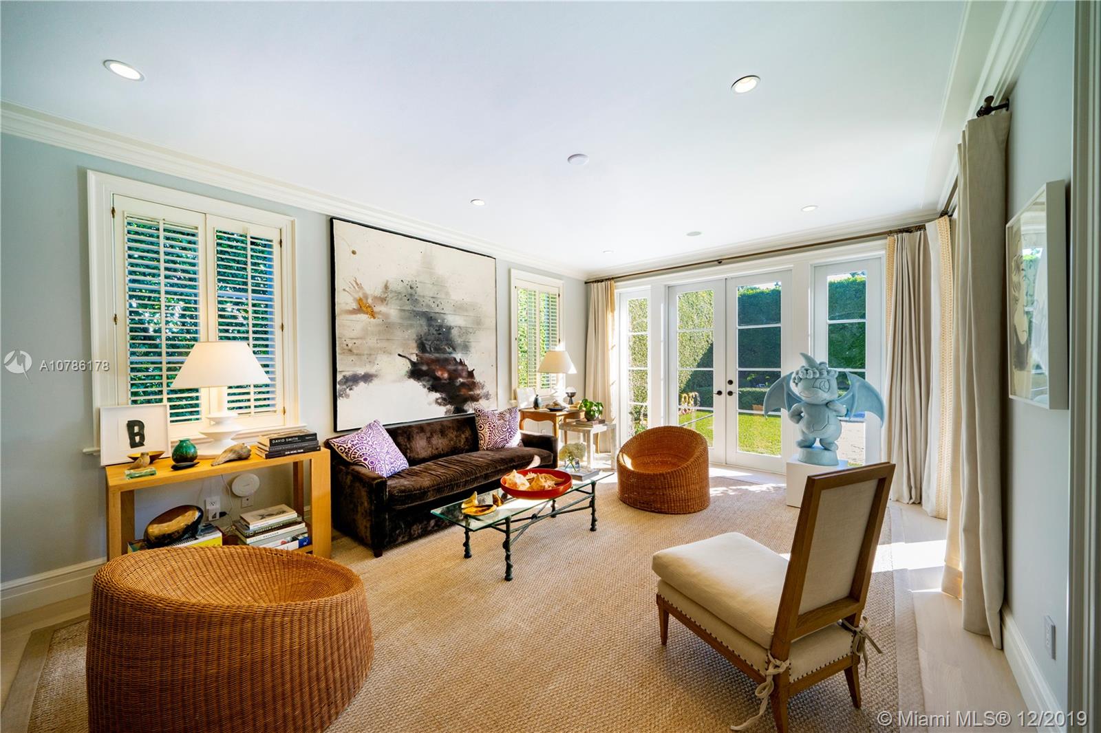 4955 Lakeview Drive Miami Beach, FL 33140 - Photo 21 of 55 a living room with furniture and a large window