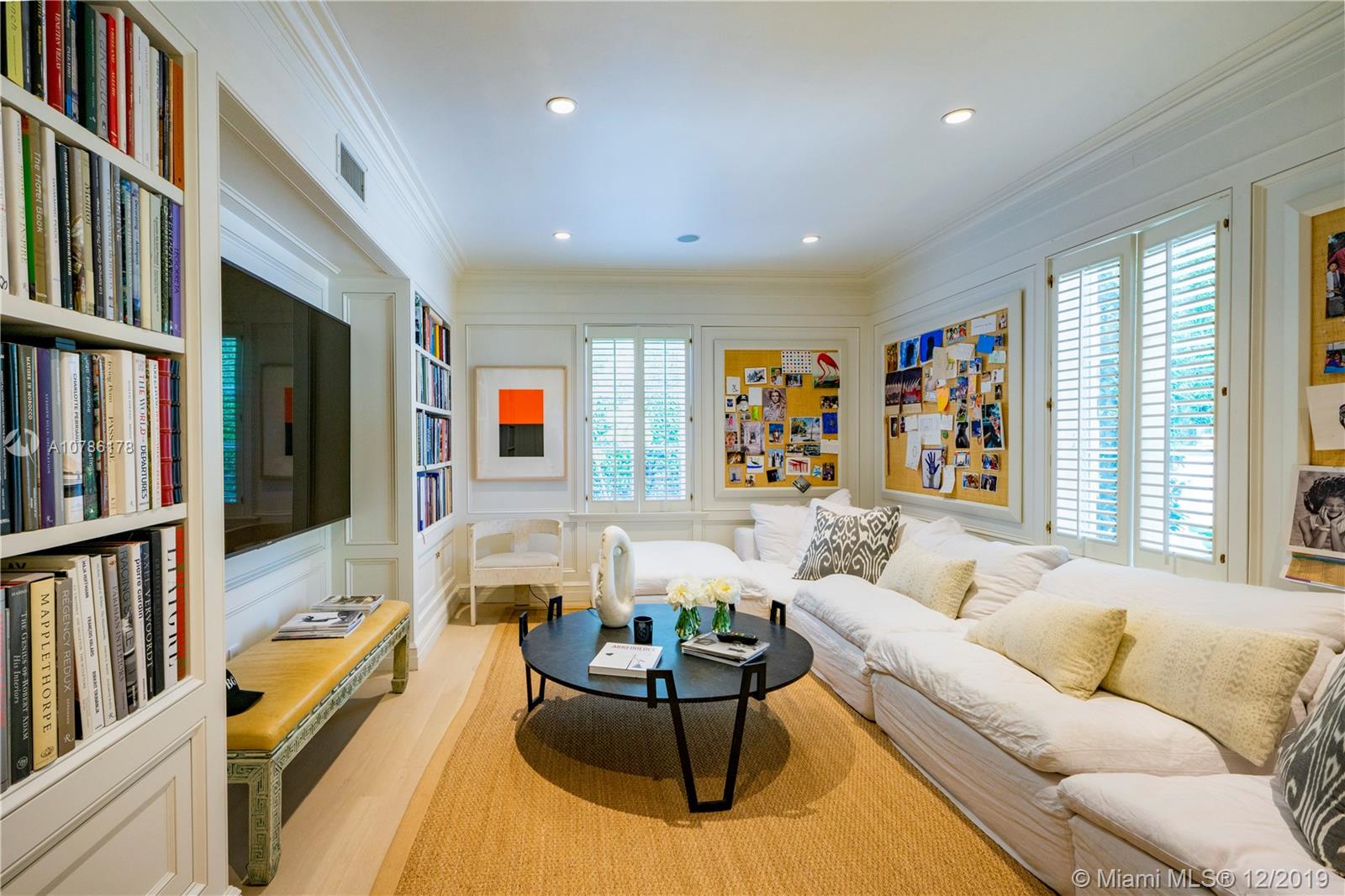 4955 Lakeview Drive Miami Beach, FL 33140 - Photo 24 of 55 a living room with furniture and a flat screen tv