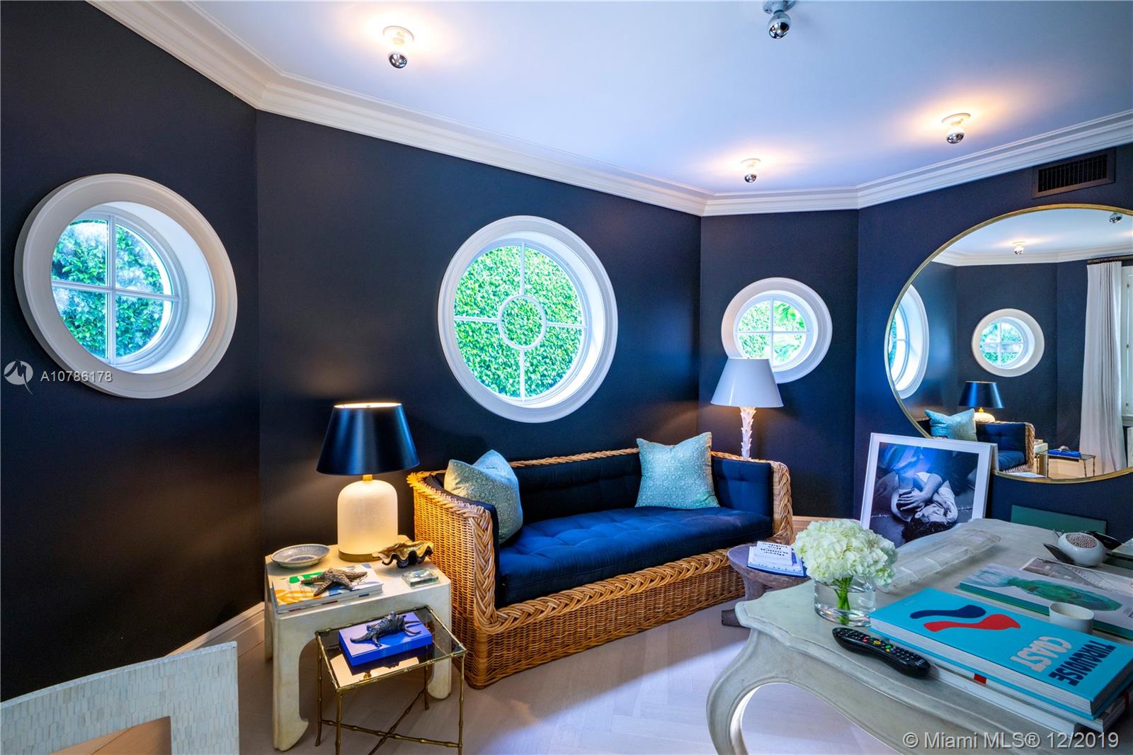 4955 Lakeview Drive Miami Beach, FL 33140 - Photo 26 of 55 a living room with furniture and a window