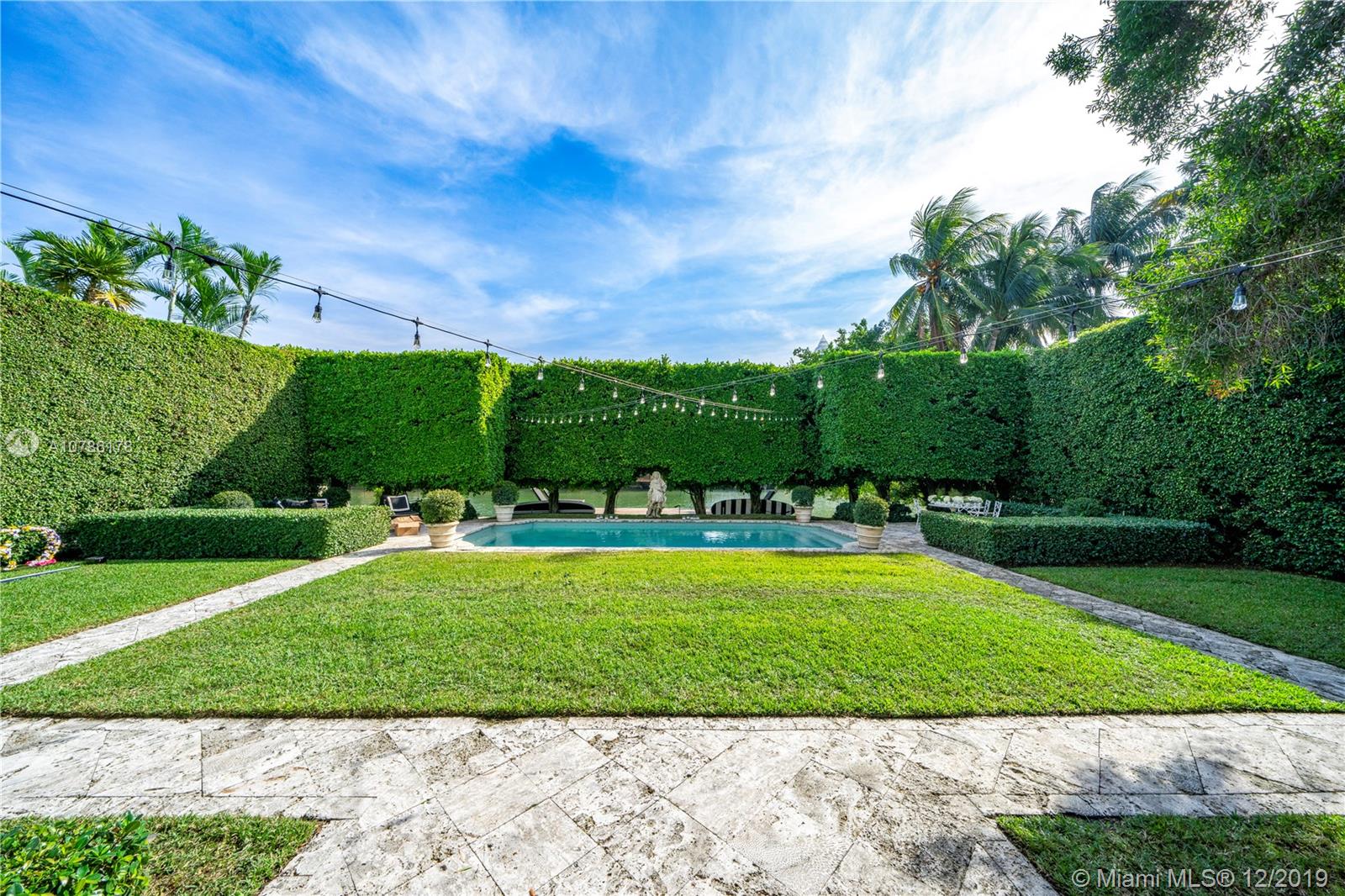 4955 Lakeview Drive Miami Beach, FL 33140 - Photo 3 of 55 a view of a backyard with sitting area