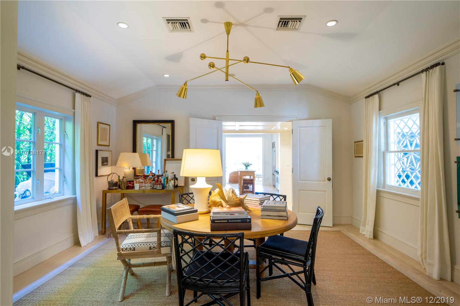 4955 Lakeview Drive Miami Beach, FL 33140 - Photo 33 of 55 a view of a dining room with furniture window and outside view