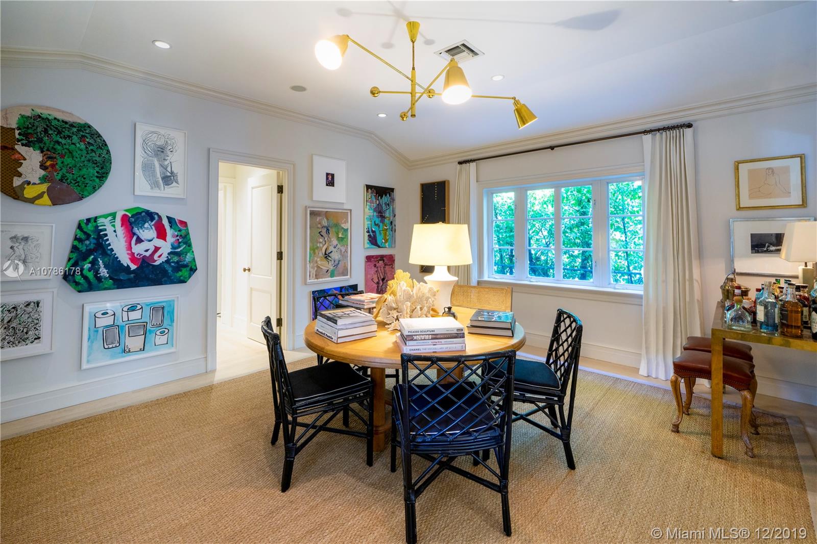 4955 Lakeview Drive Miami Beach, FL 33140 - Photo 34 of 55 a view of a dining room with furniture and a potted plant