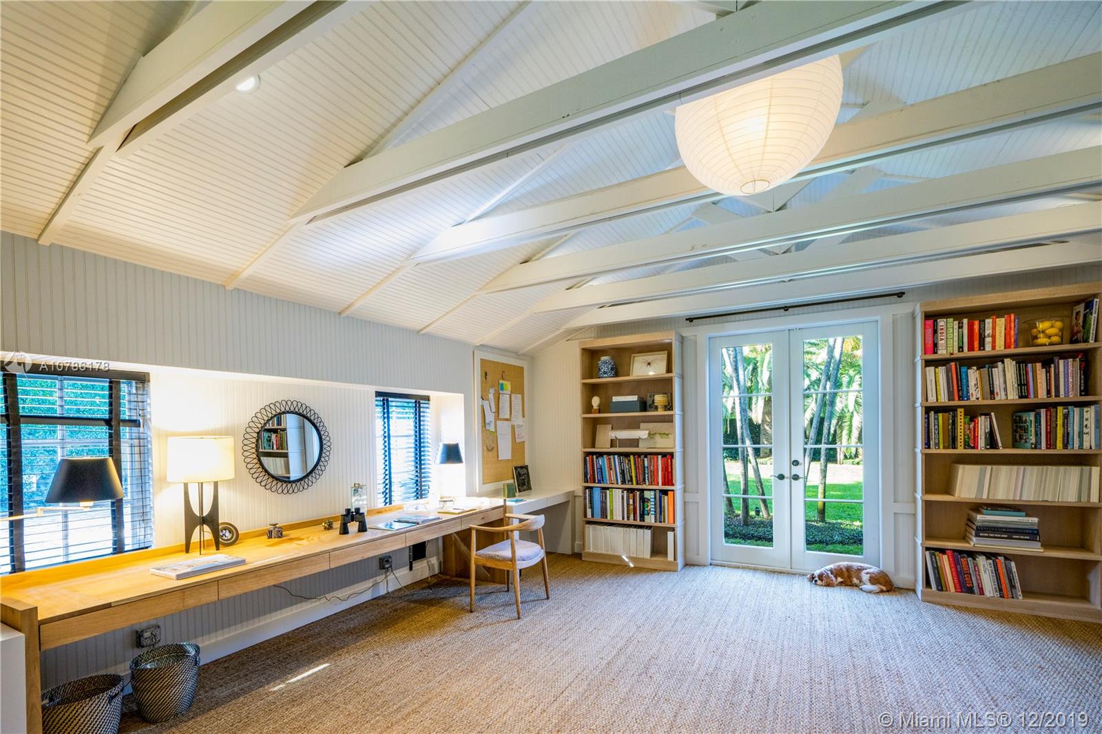 4955 Lakeview Drive Miami Beach, FL 33140 - Photo 36 of 55 a room with furniture and a table