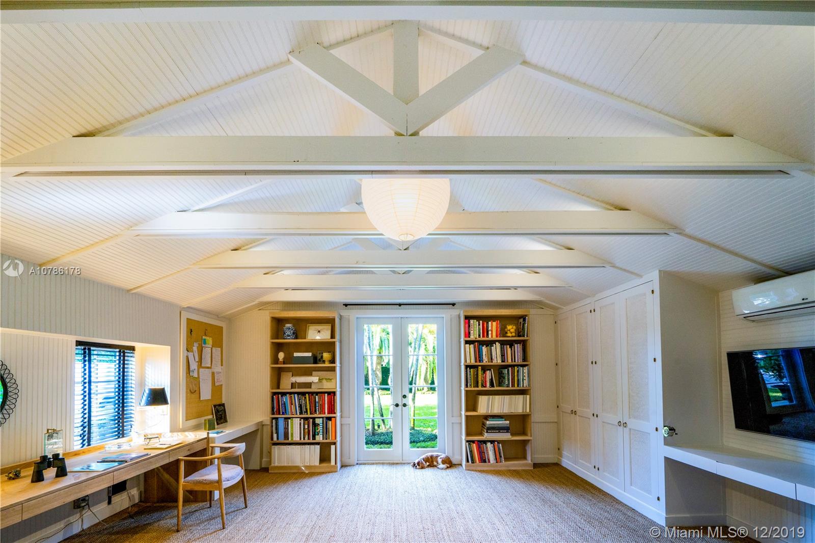 4955 Lakeview Drive Miami Beach, FL 33140 - Photo 37 of 55 a view of an empty room with furniture and staircase