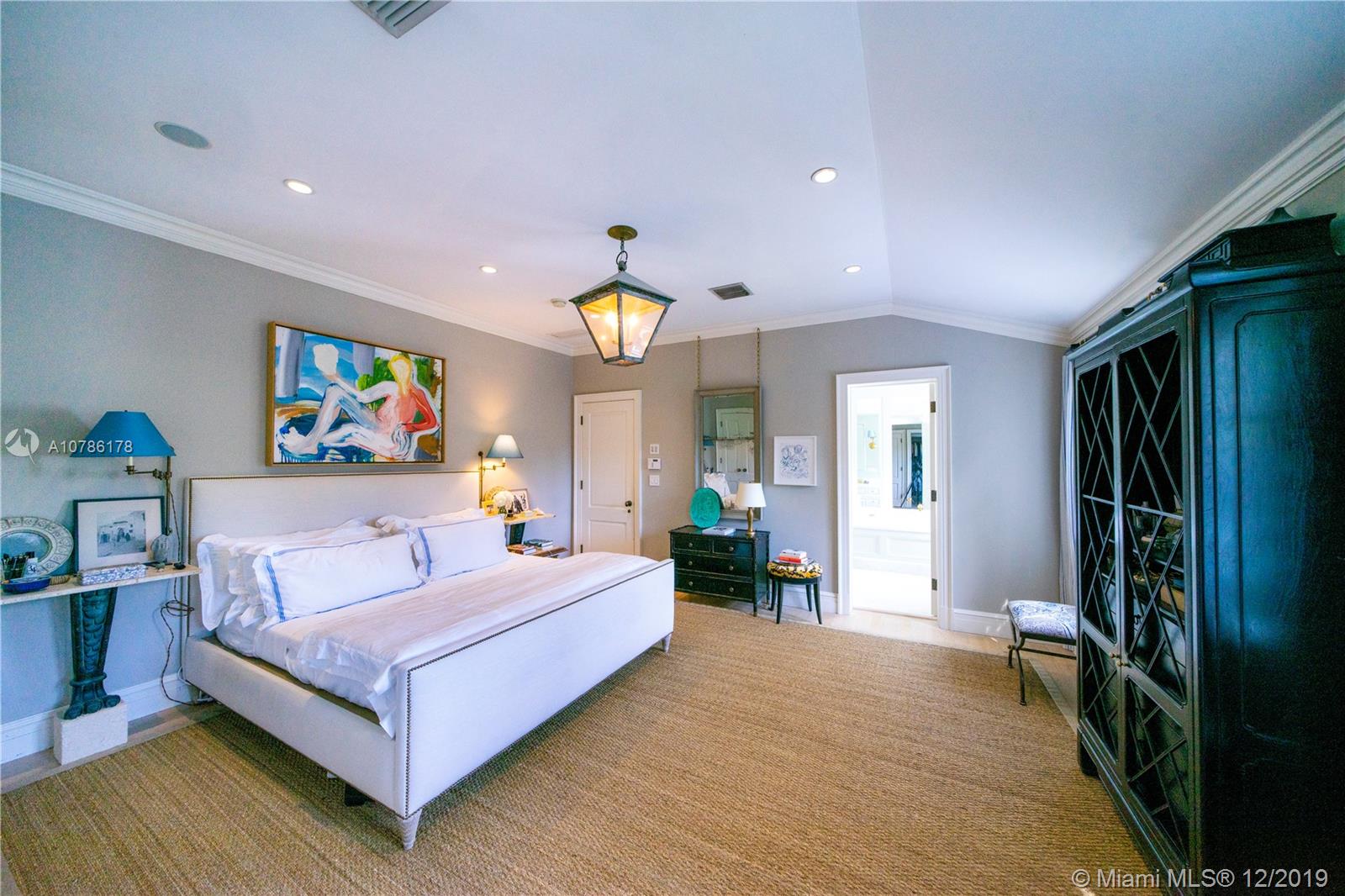 4955 Lakeview Drive Miami Beach, FL 33140 - Photo 44 of 55 a bedroom with a bed couch and a large window