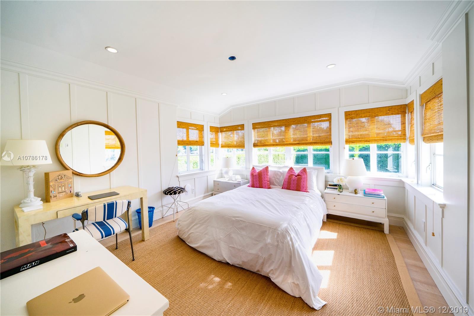 4955 Lakeview Drive Miami Beach, FL 33140 - Photo 45 of 55 a bedroom with a bed window and a large window