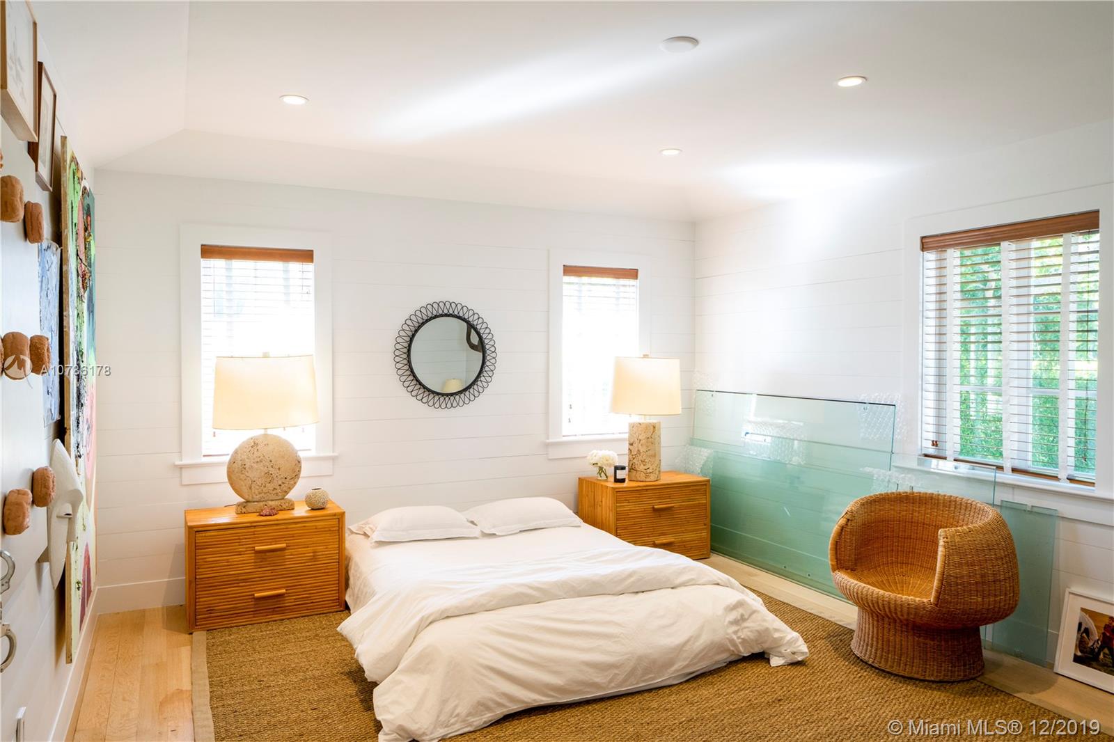 4955 Lakeview Drive Miami Beach, FL 33140 - Photo 48 of 55 a bedroom with bed and a window