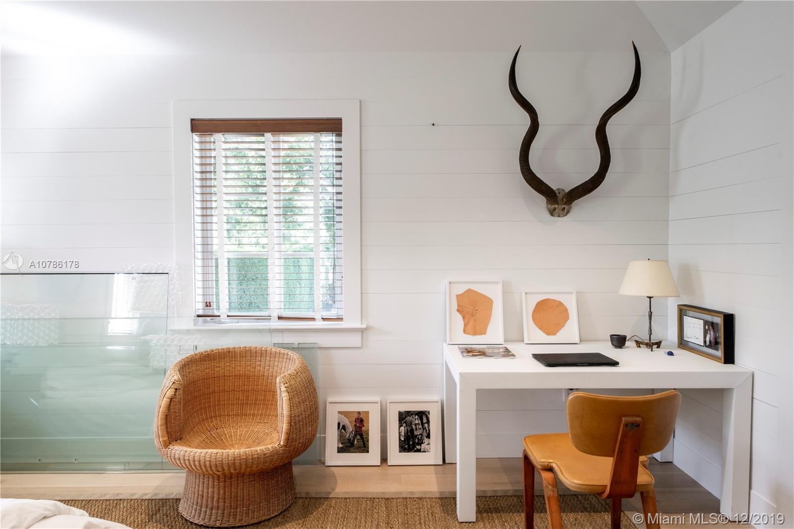 4955 Lakeview Drive Miami Beach, FL 33140 - Photo 50 of 55 a bathroom with a sink and a mirror