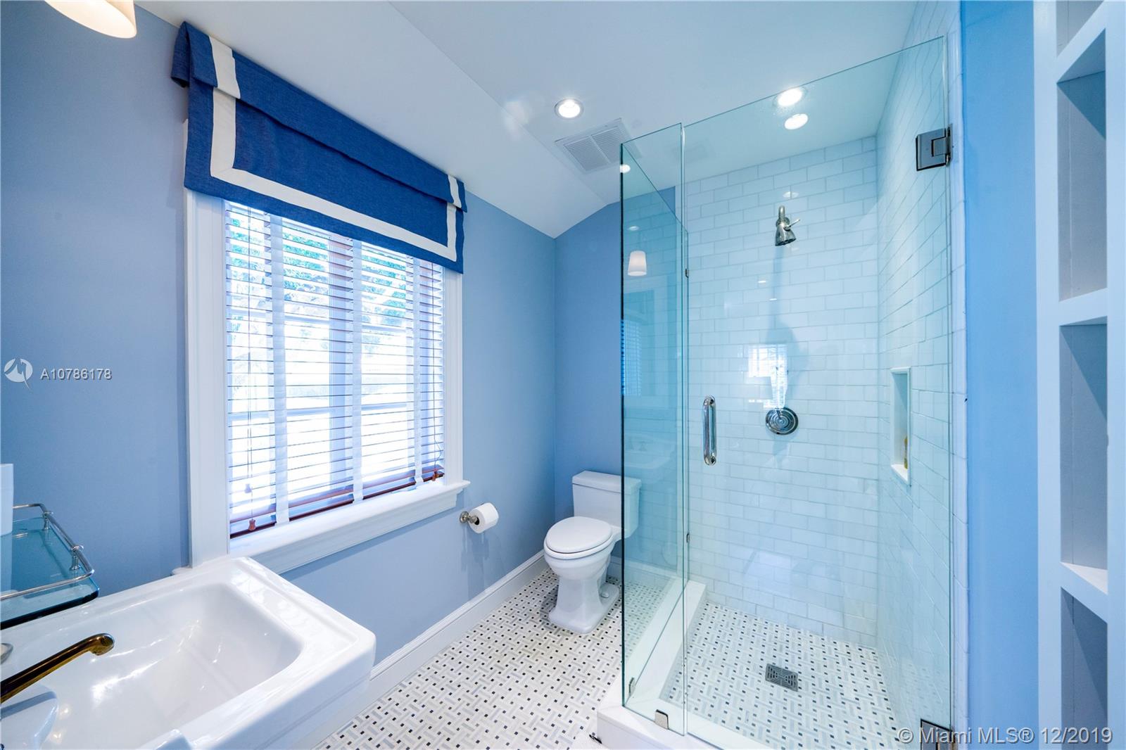 4955 Lakeview Drive Miami Beach, FL 33140 - Photo 51 of 55 a bathroom with a shower and a toilet