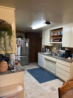 13769 Yuba-Nevada Road Dobbins, CA 95935 - Photo 13 of 18 a kitchen with stainless steel appliances kitchen island granite countertop a refrigerator and a stove top oven