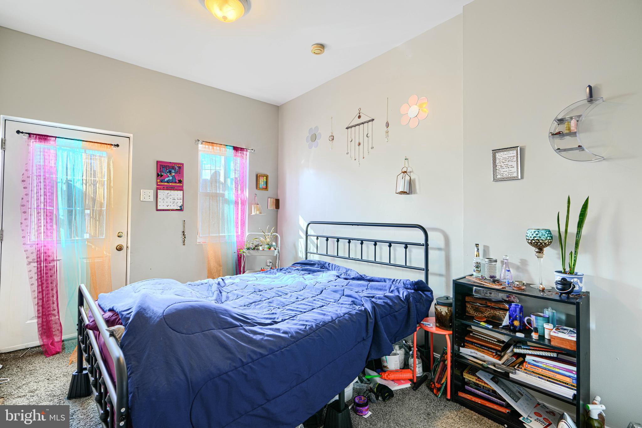 1312 South Hanover Street Baltimore, MD 21230 - Photo 13 of 53 a bedroom with a bed a dresser and book shelf