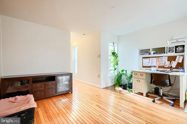 a view of a living room with a wooden floor