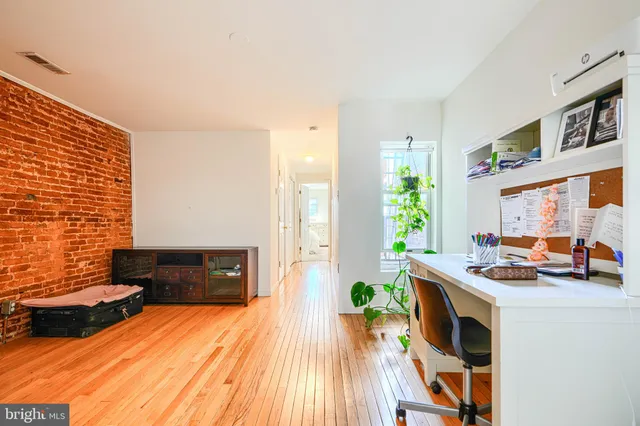 a kitchen with a refrigerator and stove