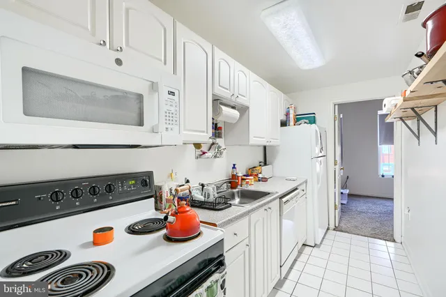 a view of a hallway with stairs