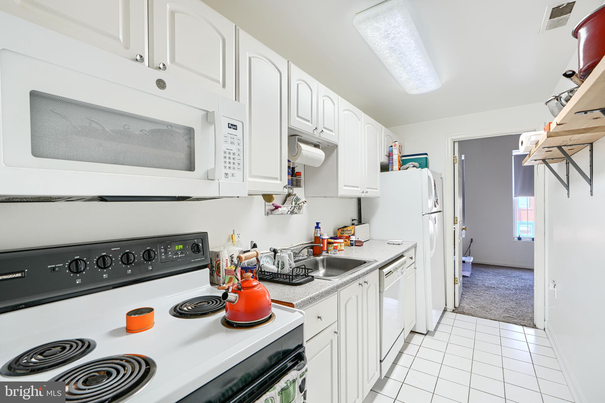 1312 South Hanover Street Baltimore, MD 21230 - Photo 19 of 53 a kitchen with a refrigerator and stove
