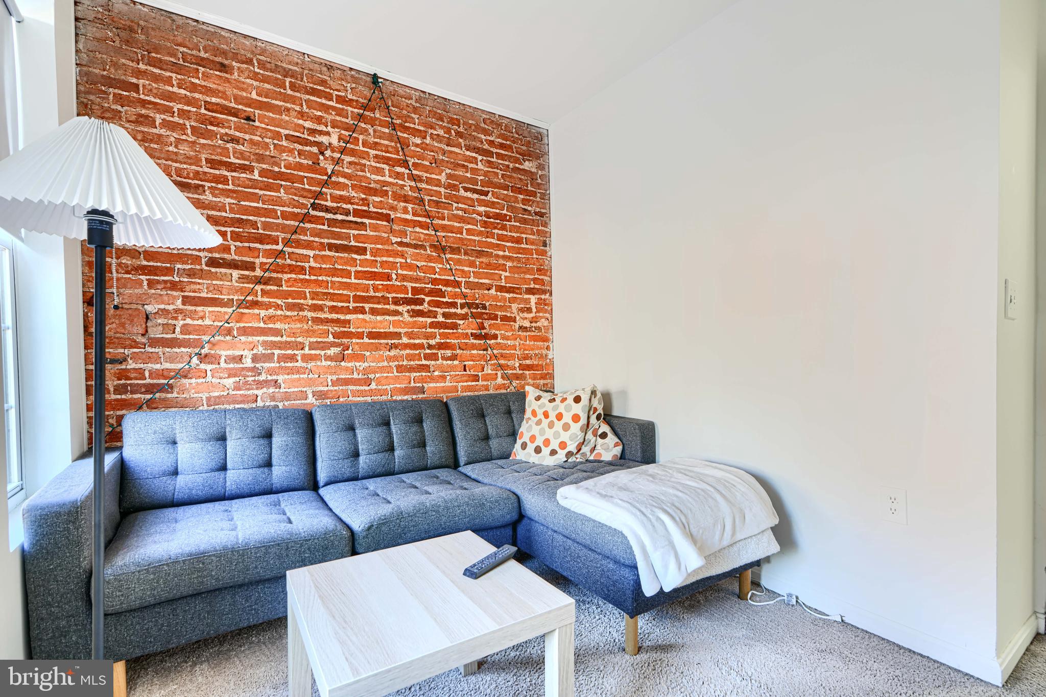 1312 South Hanover Street Baltimore, MD 21230 - Photo 25 of 53 a living room with furniture and a window