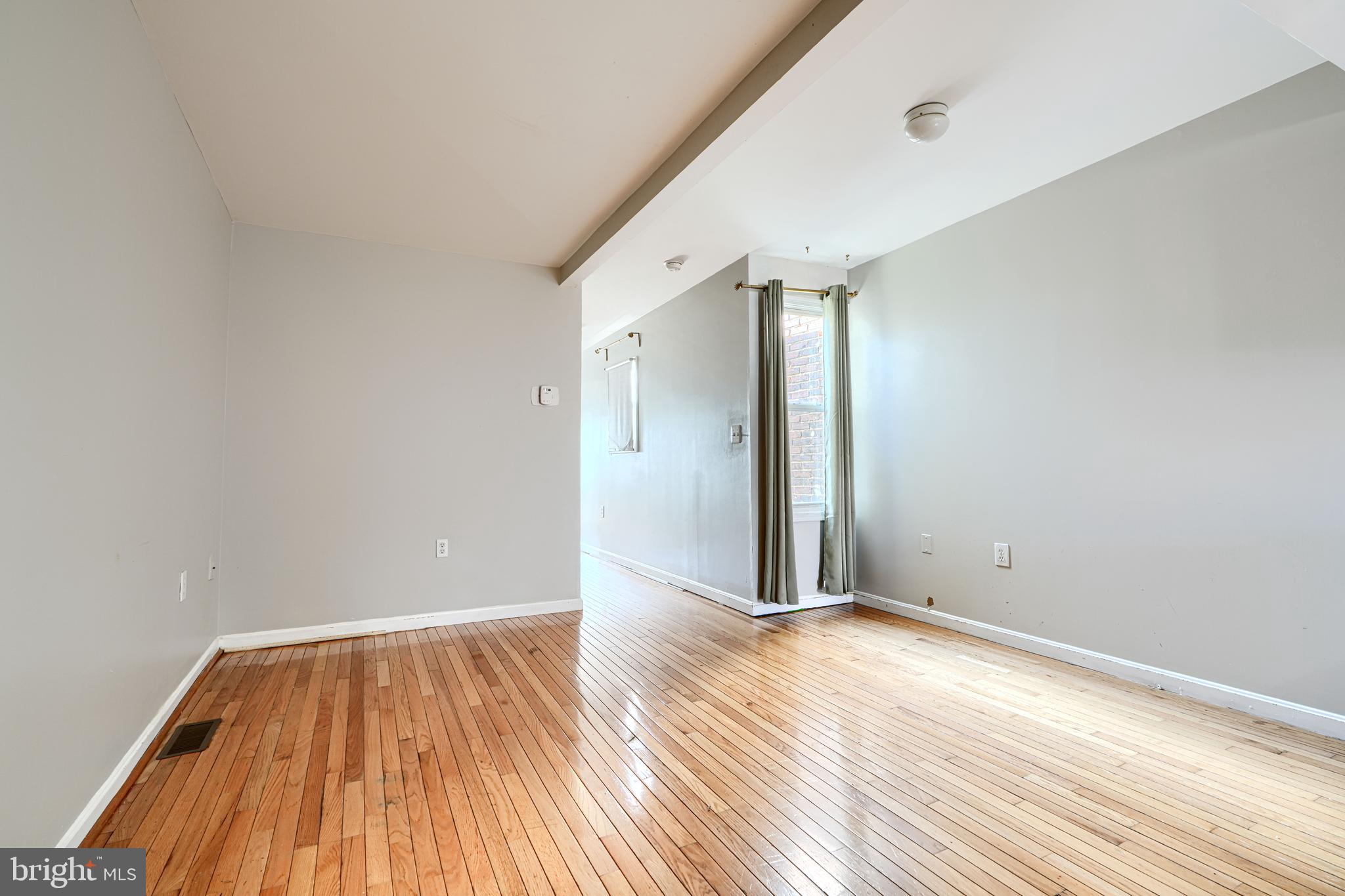 1312 South Hanover Street Baltimore, MD 21230 - Photo 33 of 53 a view of an empty room with wooden floor