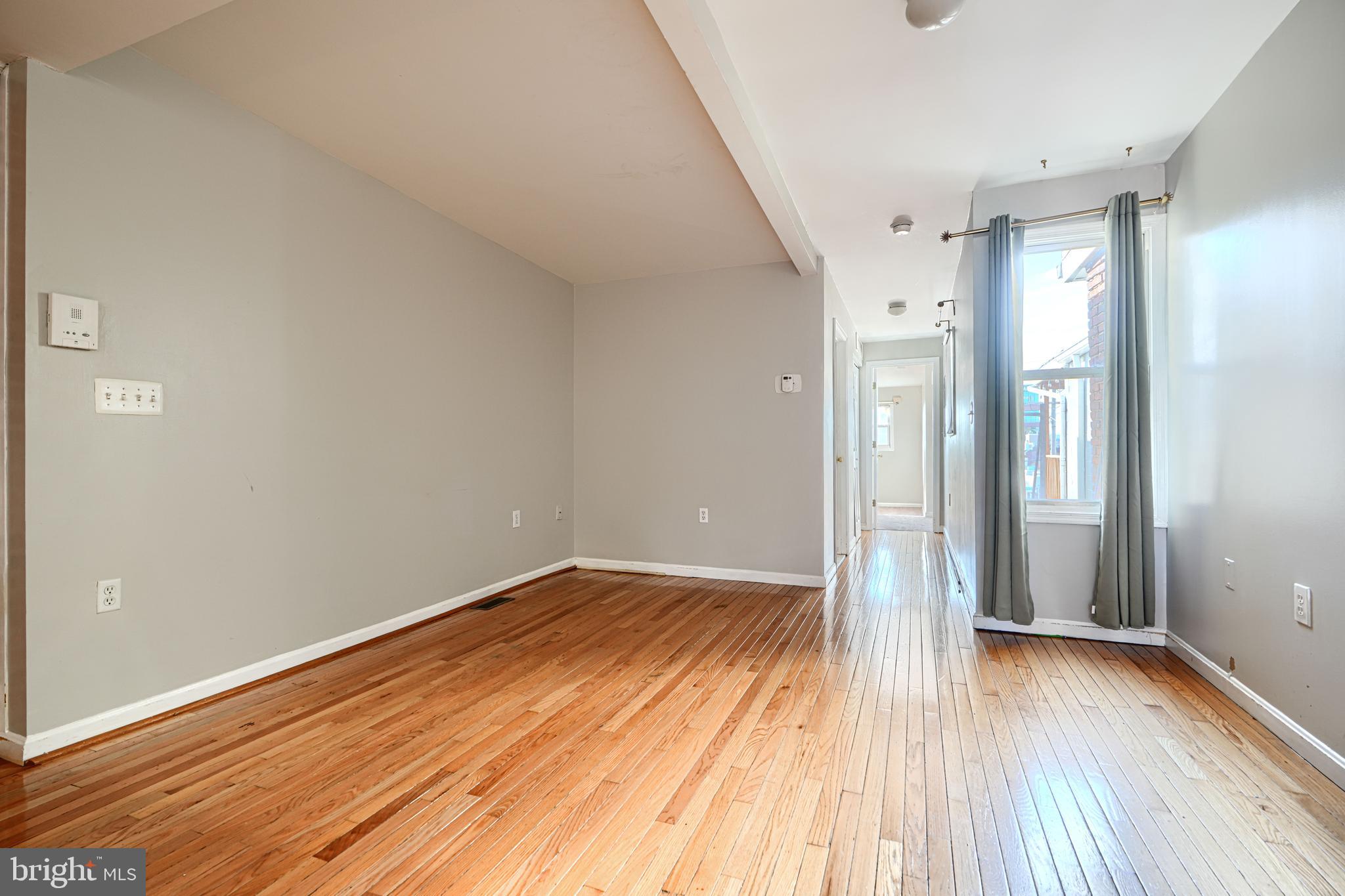 1312 South Hanover Street Baltimore, MD 21230 - Photo 36 of 53 a view of a room with wooden floor and brick walls
