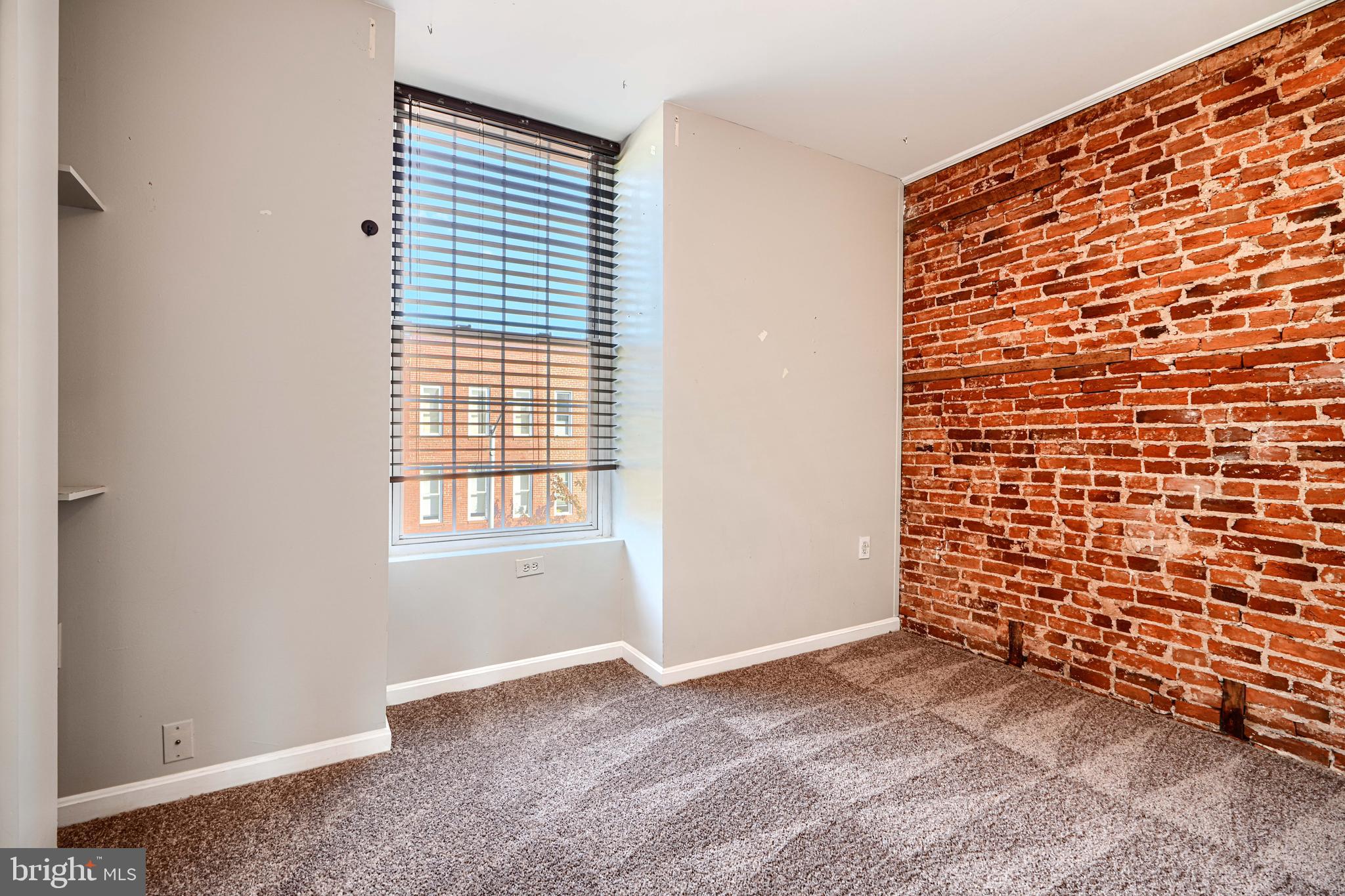 1312 South Hanover Street Baltimore, MD 21230 - Photo 41 of 53 a view of an empty room with a window