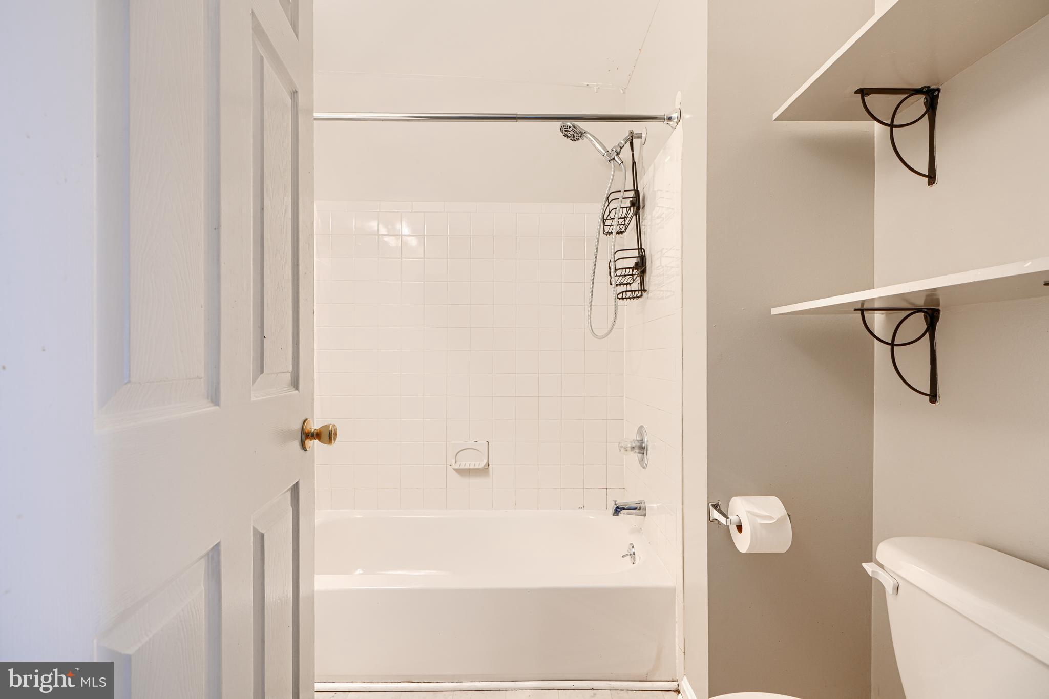 1312 South Hanover Street Baltimore, MD 21230 - Photo 47 of 53 a bathroom with a shower and a toilet