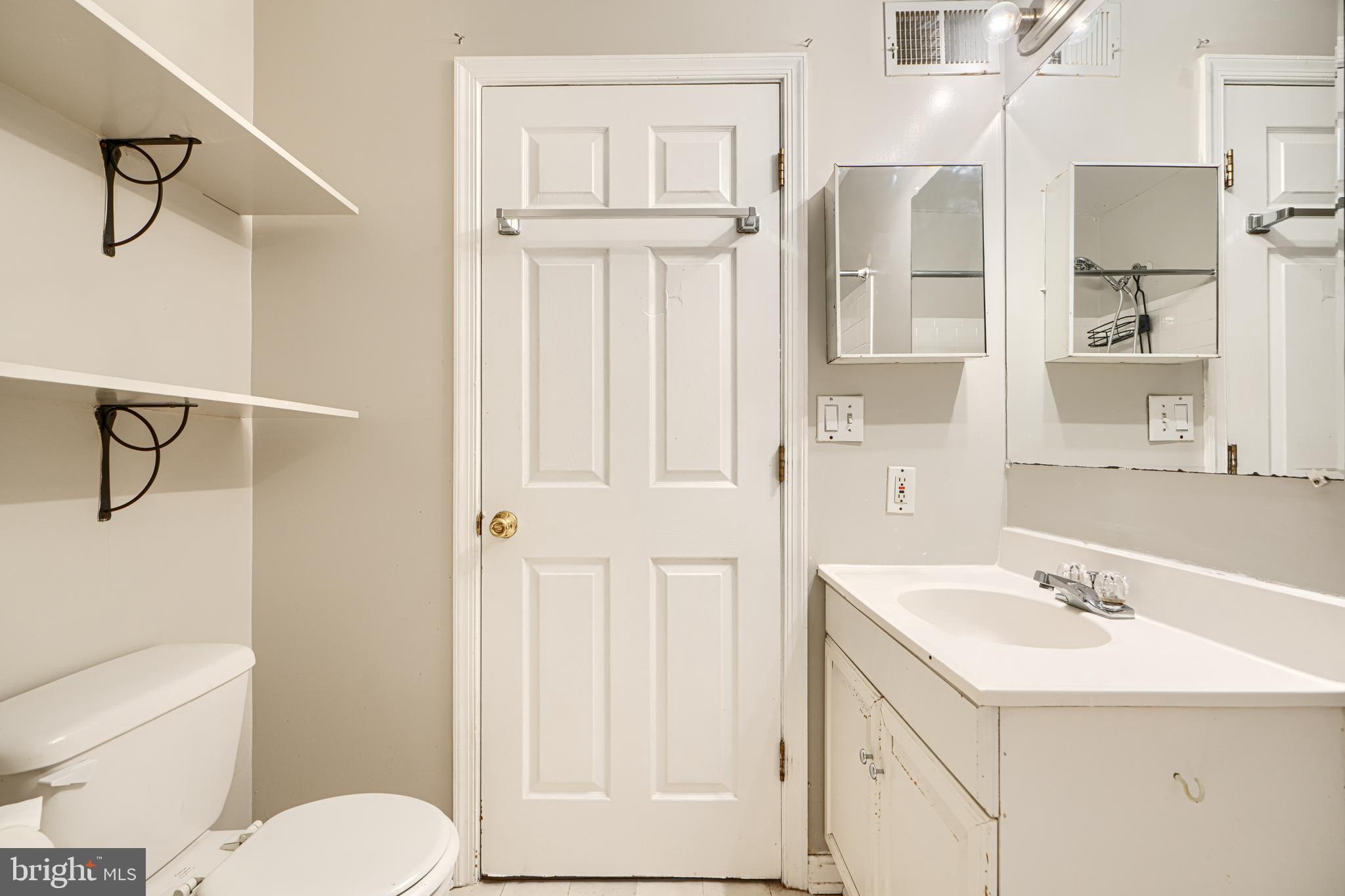 1312 South Hanover Street Baltimore, MD 21230 - Photo 49 of 53 a bathroom with a sink a toilet and shower