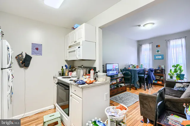 a bedroom with furniture and a potted plant