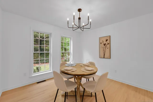 a view of a dining room with furniture window and outside view