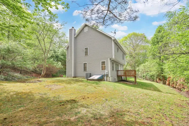 a house that has a tree in front of it