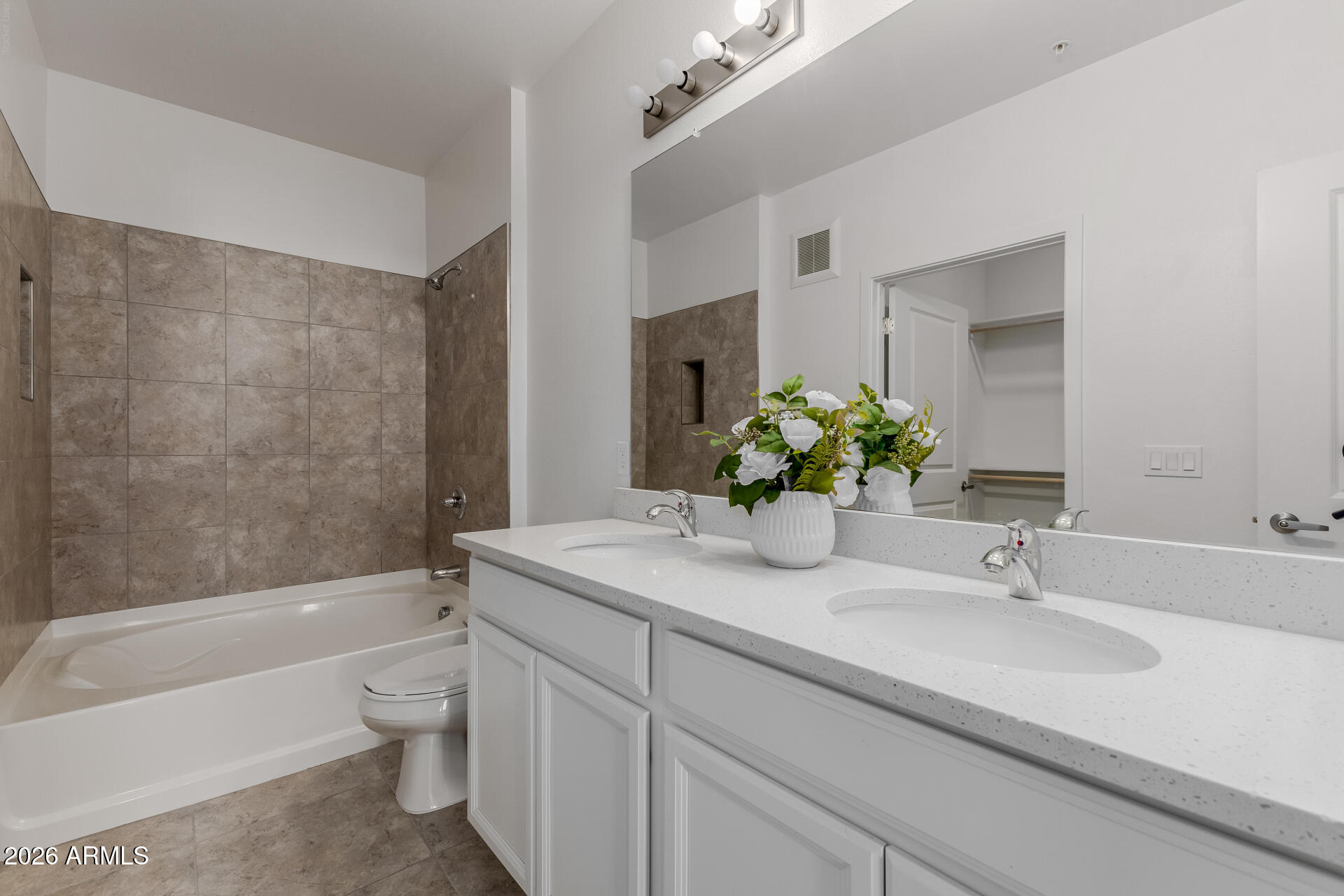 2511 West Queen Creek Road, Unit 279 Chandler, AZ 85248 - Photo 16 of 35 a bathroom with a sink a bathtub and a toilet