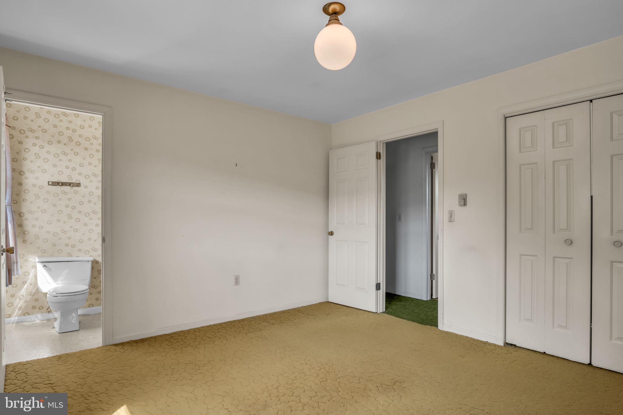 609 Dellville Road Duncannon, PA 17020 - Photo 19 of 48 a view of an empty room with wooden floor and a cabinet