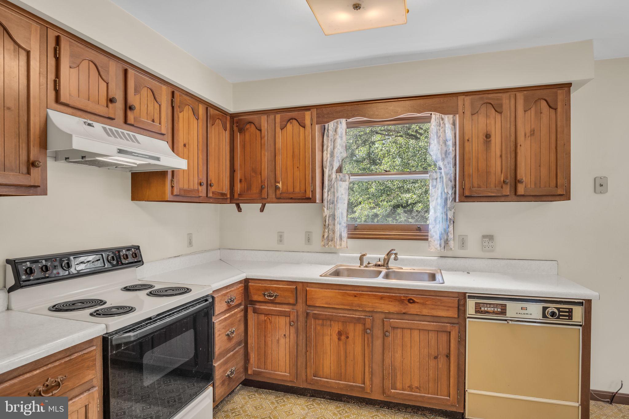 609 Dellville Road Duncannon, PA 17020 - Photo 3 of 48 a kitchen with stainless steel appliances granite countertop a sink stove and cabinets