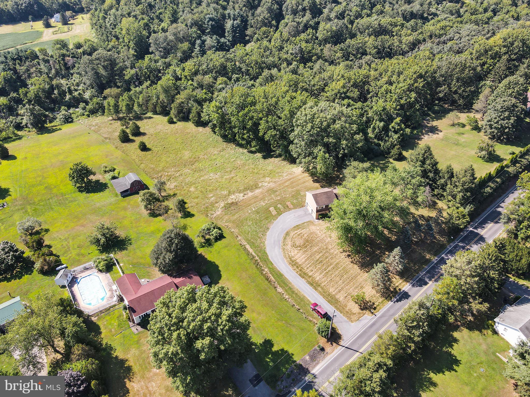 609 Dellville Road Duncannon, PA 17020 - Photo 34 of 48 an aerial view of a house with a yard and swimming pool