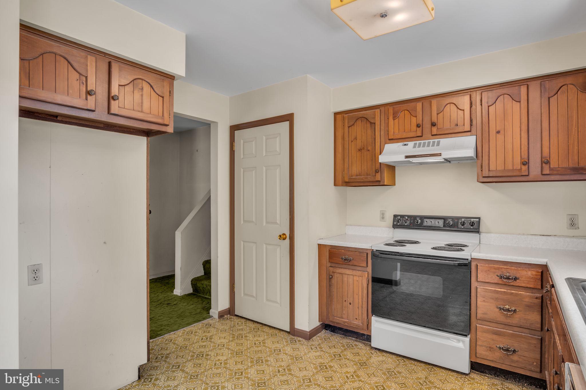 609 Dellville Road Duncannon, PA 17020 - Photo 5 of 48 a kitchen with stainless steel appliances granite countertop a stove and a refrigerator