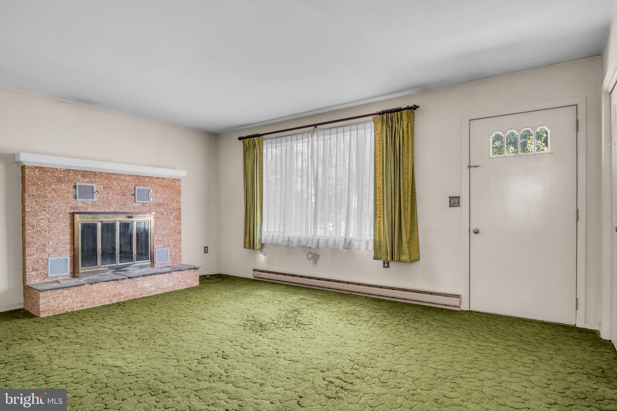 609 Dellville Road Duncannon, PA 17020 - Photo 10 of 48 a view of an empty room with window and fireplace