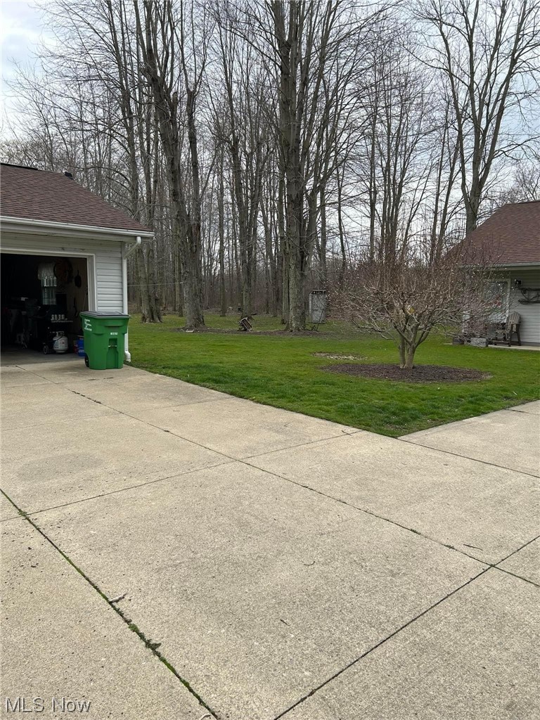 7500 Sanborn Road Ashtabula, OH 44004 - Photo 3 of 26 Attached 1 car garage, paved driveway