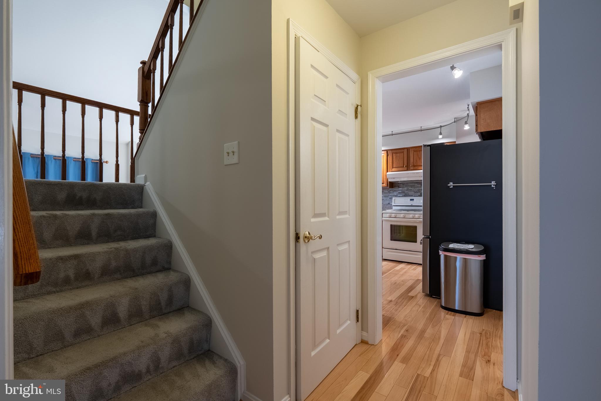 8007 Craddock Road Greenbelt, MD 20770 - Photo 19 of 59 Inviting entryway with staircase charm.