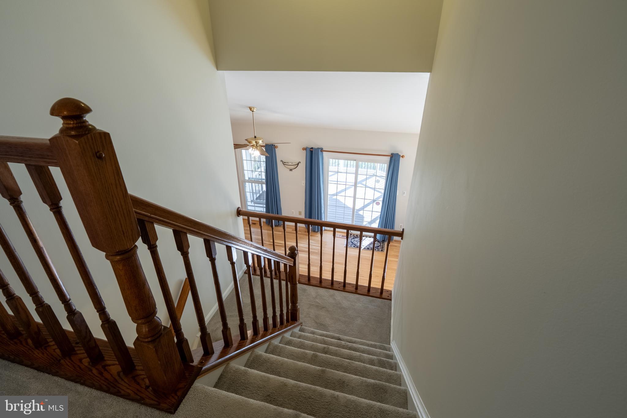8007 Craddock Road Greenbelt, MD 20770 - Photo 20 of 59 Inviting staircase leading to bright living space.