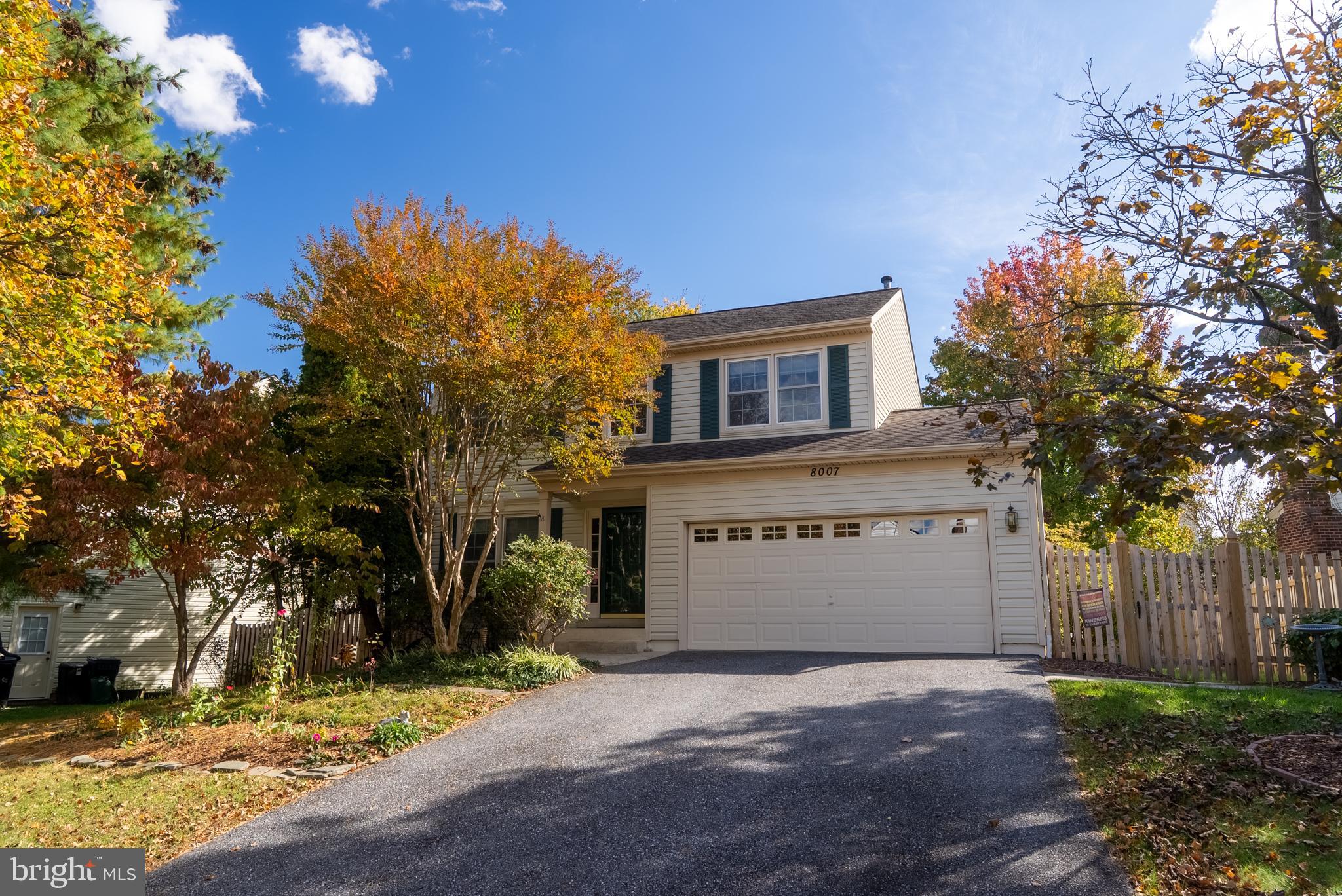 8007 Craddock Road Greenbelt, MD 20770 - Photo 2 of 59 Charming home framed by vibrant autumn foliage.